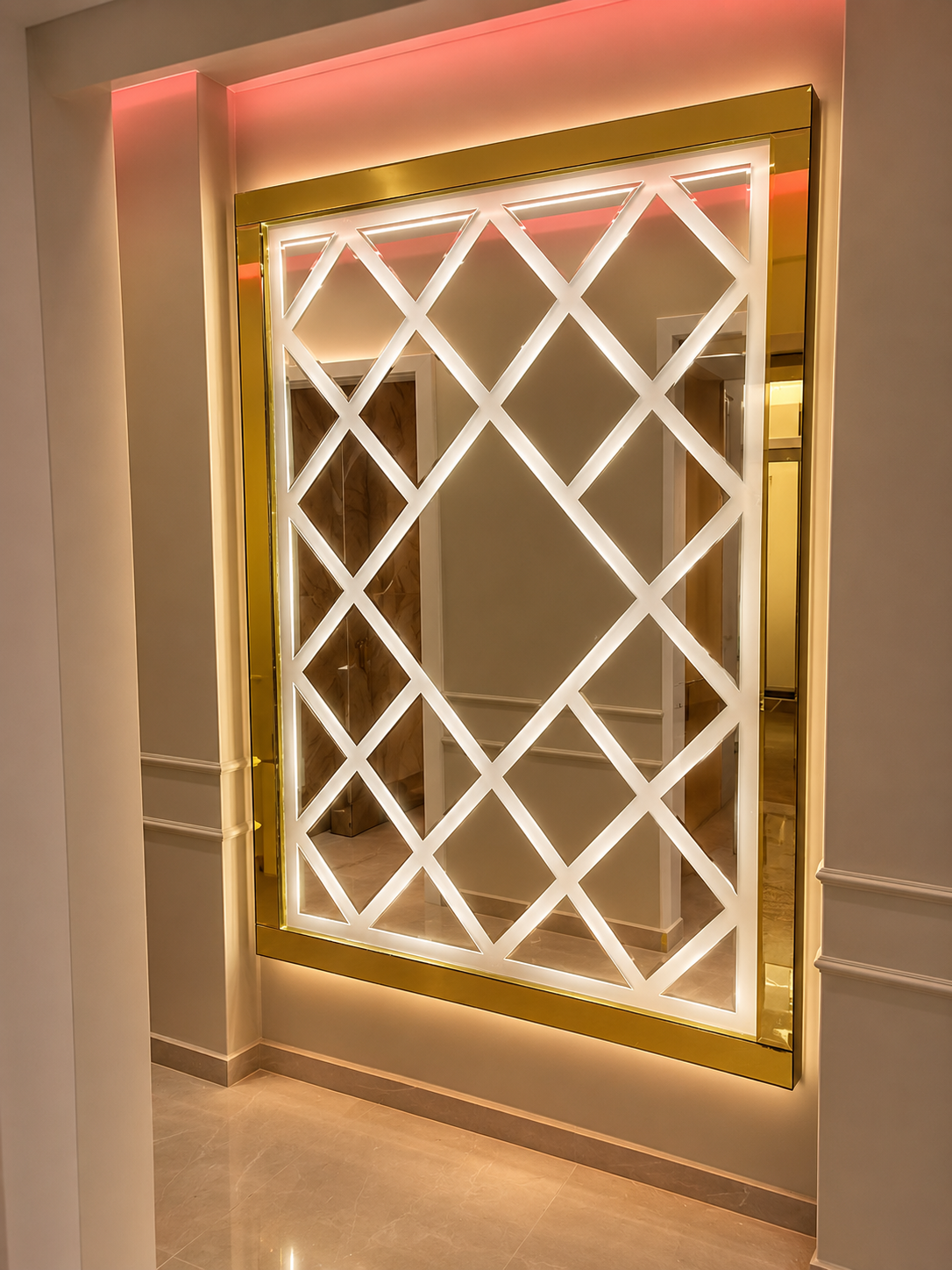 Illuminated diamond lattice mirror with a polished gold frame installed in a modern residential hallway.